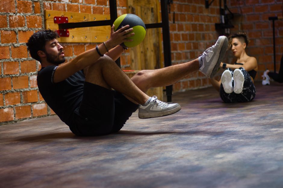 partner wall ball exercise gym handoff