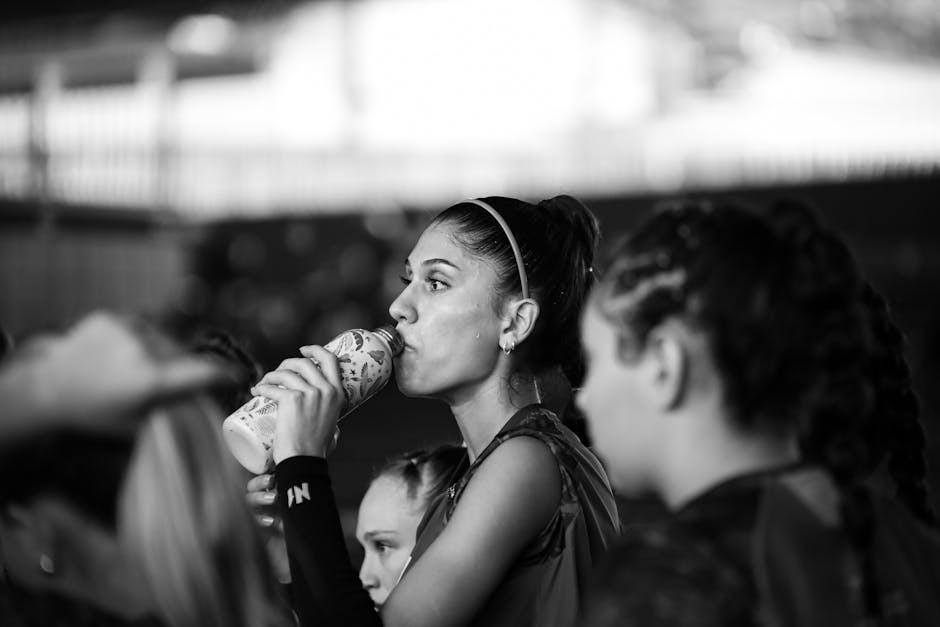 HYROX athlete drinking sports drink during competition