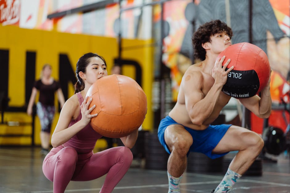 functional fitness athlete wall ball squat technique