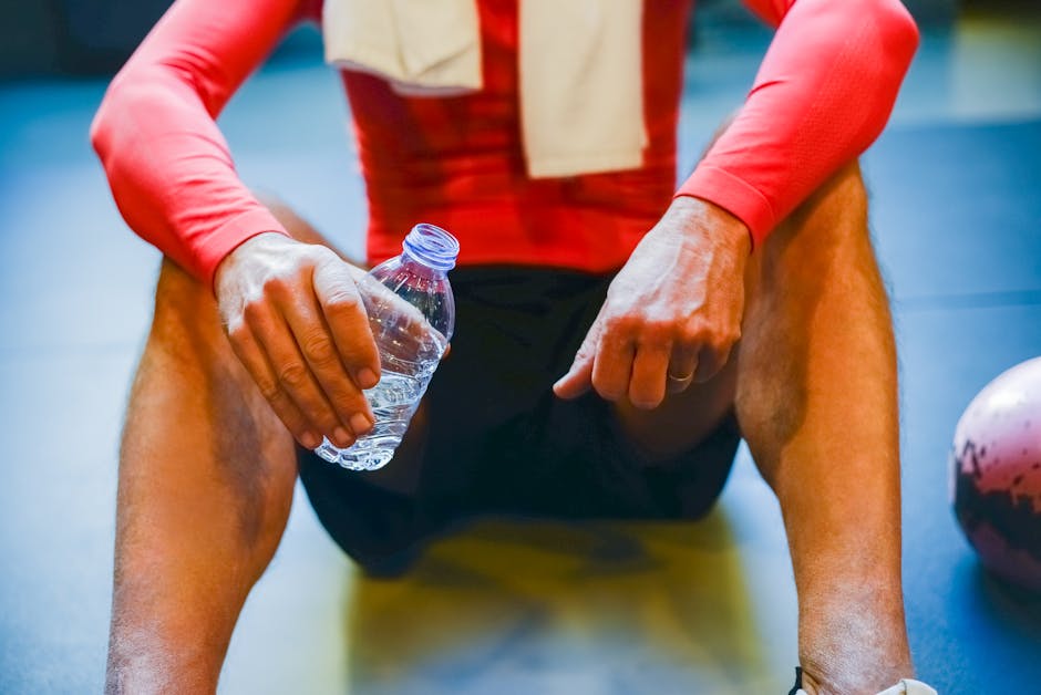 fitness athlete cooling down water bottle towel competition