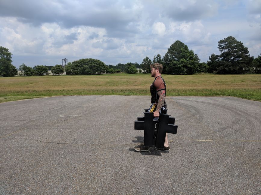 farmer carry posture elbow position strongman training